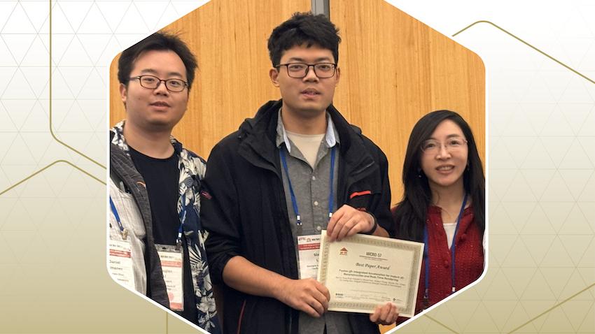 Researchers holding award certificate.