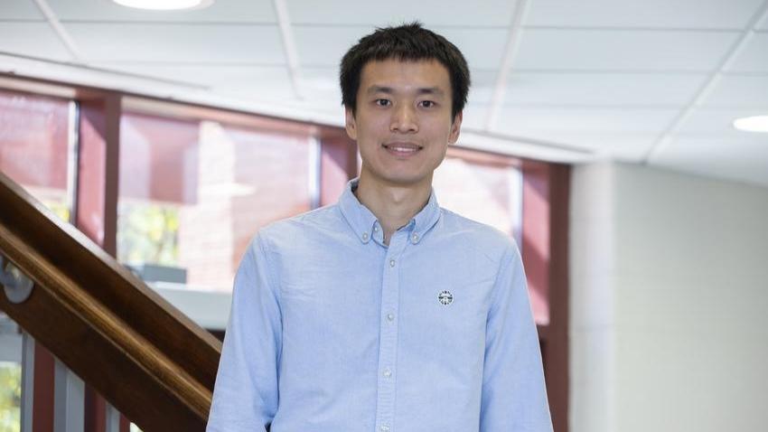 man standing in front of staircase